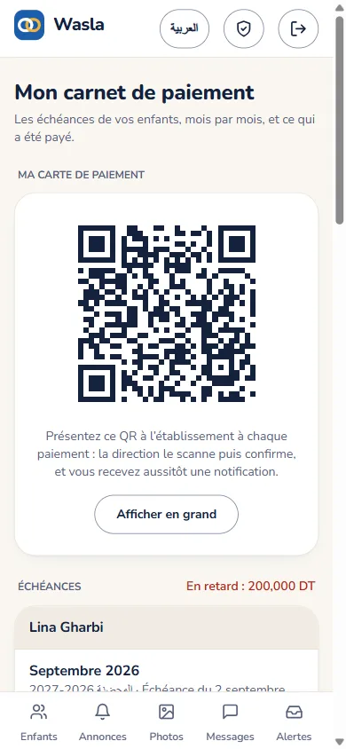 Carnet de paiement d'un parent avec sa carte QR.